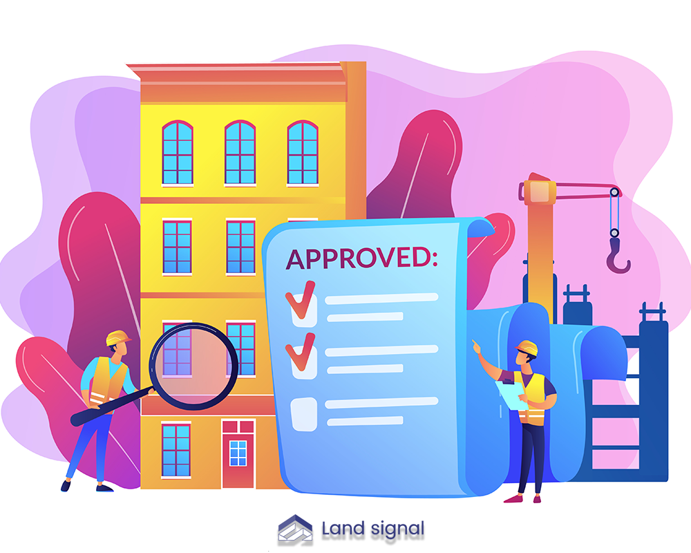 Builders inspecting a building while reviewing an approved permit document beside construction equipment.